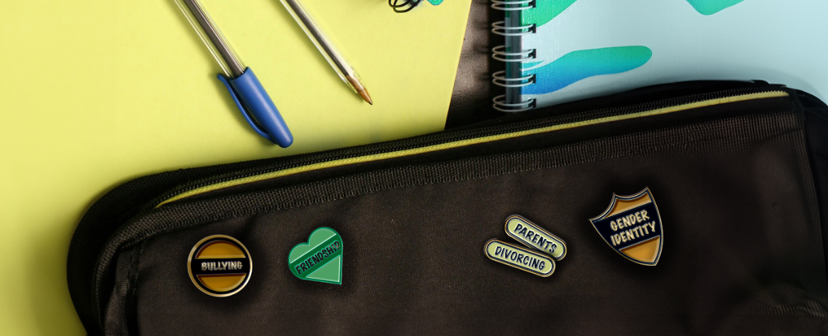 A school scene with badges that read bullying, friendship, parents, divorcing and gender identity.